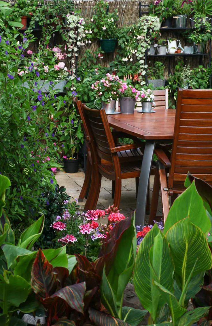 Surrounding your seating area with lots of greenery is a great way to make your backyard feel cozy. Here are 10 inviting backyard ideas for all types of gatherings.