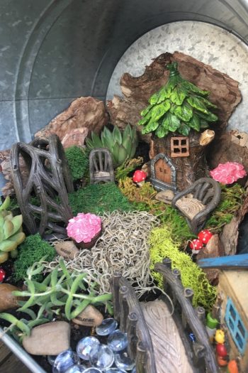 If you've ever thought about putting in a fairy garden in your garden, I highly recommend it. For more garden art ideas, look hrere. 