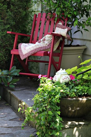 There's no denying the charm of a cottage flower garden. Did you know you can extend that charm all the way through to your front porch? I love giving a porch the look of a cottage flower garden, and you can too. Having chairs or benches is important so you can sit and enjoy your yard. 