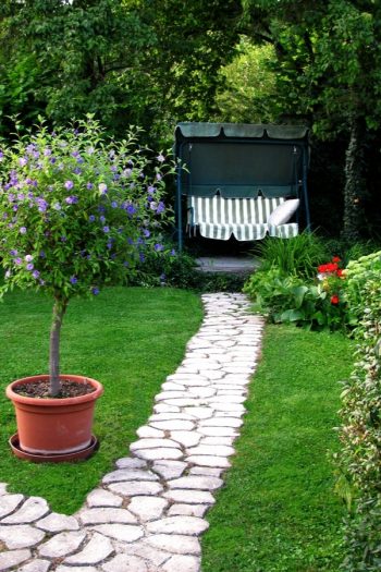 If you have a garden, but not a rock pathway, it's time to fix that right now. Today I have rock pathway ideas to inspire any gardener to make a beautiful garden just that much better. A rock pathway makes a statement that bids the beholder to follow, to more fully enjoy the garden and take time to smell the roses. See how you can DIY your own rock pathway. 