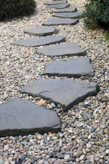 If you have a garden, but not a rock pathway, it's time to fix that right now. Today I have rock pathway ideas to inspire any gardener to make a beautiful garden just that much better. A rock pathway makes a statement that bids the beholder to follow, to more fully enjoy the garden and take time to smell the roses. These stones would look great in any yard. 